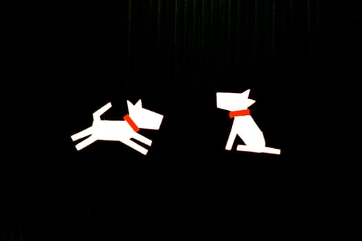 dog character on black scene that made from paper cutting handcraft ,shallow focus