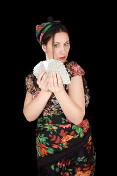 Gypsy woman with cards in hand on black background