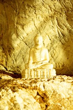 white stone buddha image in the big cave,Lampang,Thailand