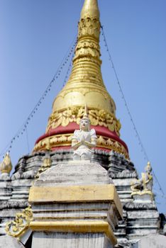 burmese traditional angel sculpture standing to protected pagoda,Lampang temple,Thailand