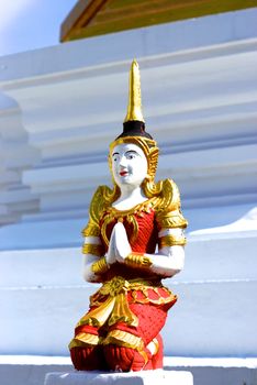 thai traditional angel sculpture standing to protected pagoda,Lampang temple,Thailand