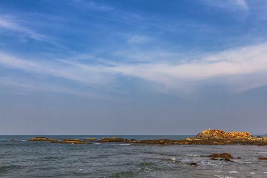 View from beach in Goa to Arabian sea. Rock near sea