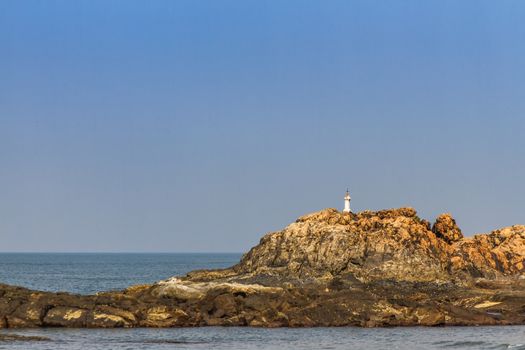 View from beach in Goa to Arabian sea. Rock near sea