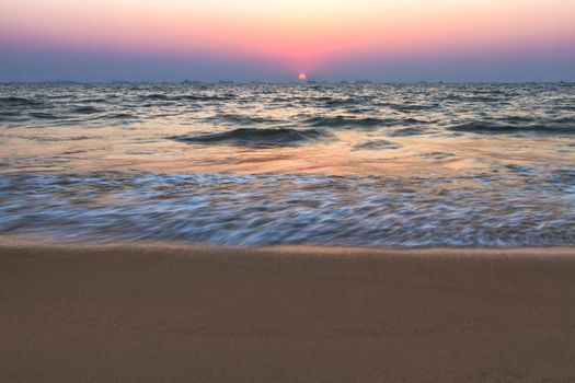 Scenic view from sand beach in Goa to beautiful sunset above the Arabian sea