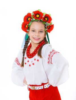 A little girl in Ukrainian national dress on the white background