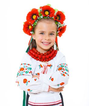 A little girl in Ukrainian national dress on the white background