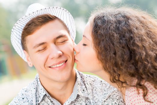 girl kissing a man on the cheek, spending time with loved ones