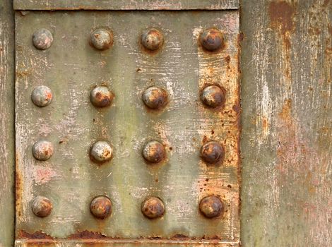 grown old gray background with steel rivets to rust