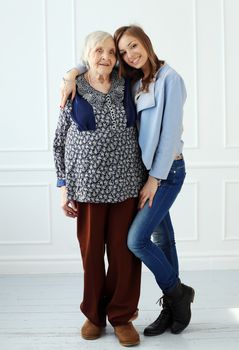 Elderly woman and beautiful granddaughter
