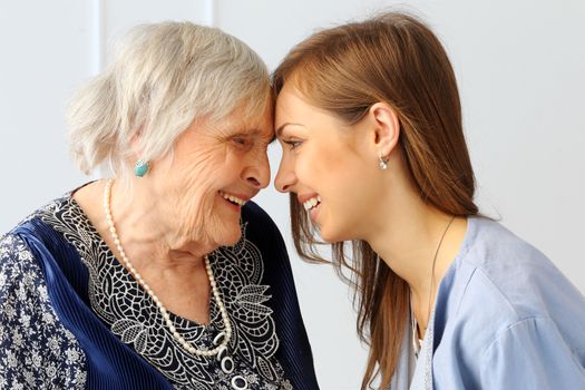 Close-up. Elderly woman and beautiful granddaughter with wide smile