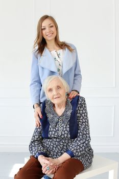 Elderly woman and beautiful granddaughter