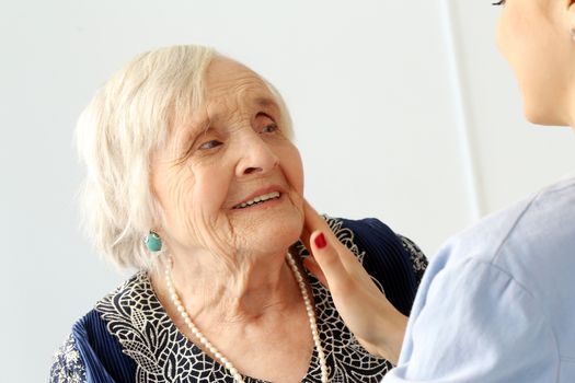 Close-up. Elderly woman and beautiful granddaughter