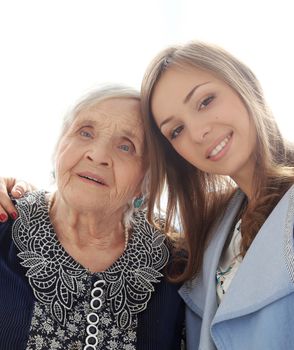 Close-up. Elderly woman and beautiful granddaughter with wide smile