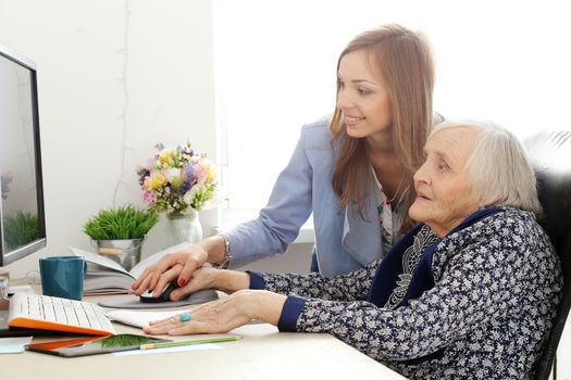 Elderly woman and beautiful teacher