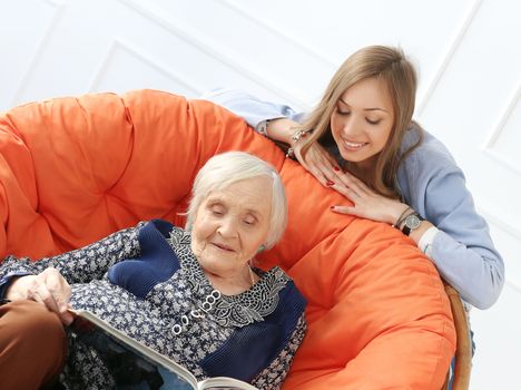 Close-up. Elderly woman and beautiful granddaughter