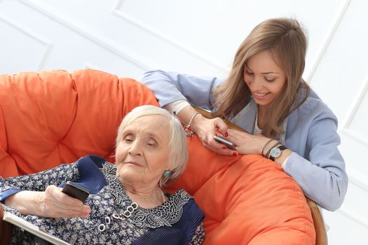 Elderly woman and beautiful granddaughter with wide smile