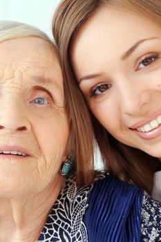 Close-up. Elderly woman and beautiful granddaughter with wide smile