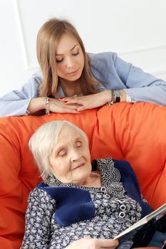 Close-up. Elderly woman and beautiful granddaughter