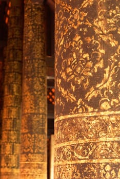 the detail of  thai gold painting pattern on ancient  wood temple pillar,shallow focus,Lampang temple,Thailand