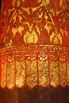 the detail of  thai gold painting pattern on ancient  temple pillar,shallow focus,Lampang temple,Thailand