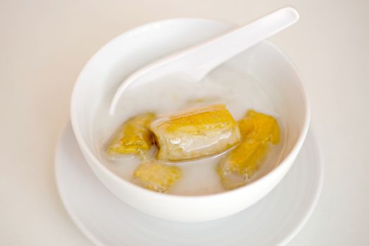 banana in coconut milk,Sweet yellow banana Topped with coconut milk is the famous dessert Thailand