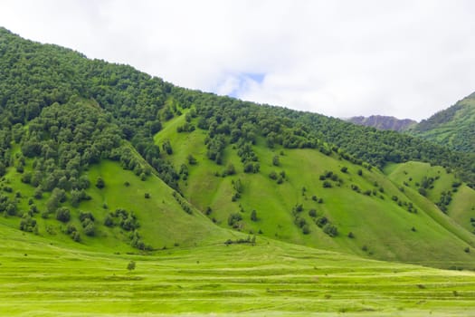 Summer landscape with Russian Caucasus green mountains