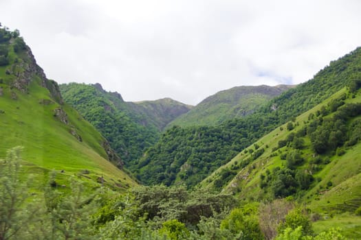 Summer landscape with Russian Caucasus green mountains