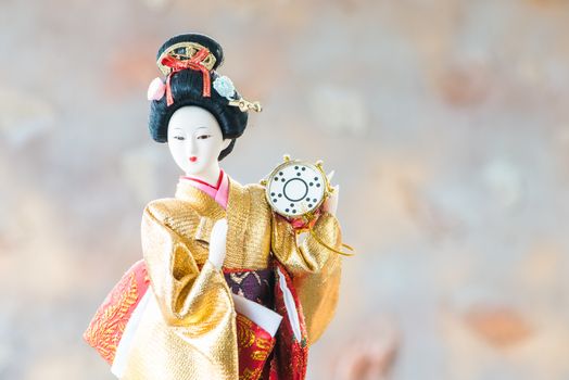 Japanese Doll on blur background.