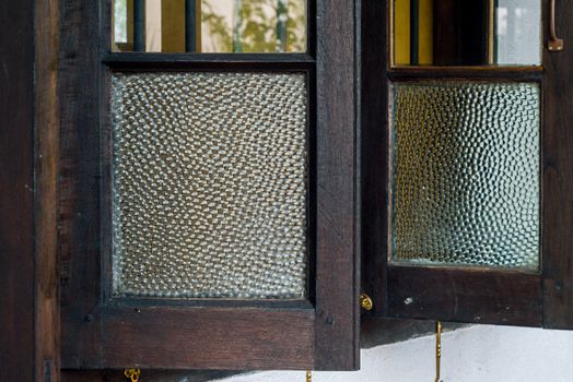 Old wooden window with old frosted glass