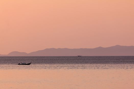 Fisherman 's boat in sea at Loh Dalum Bay,Phi Phi island Krabi,Thailand.(in warm tone)