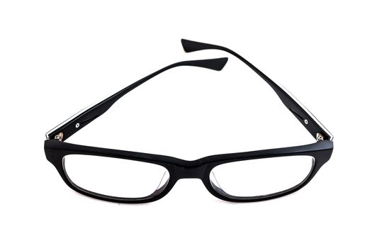 Old eyeglasses on white background