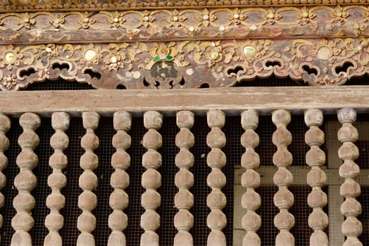 the row of antique wood bar at Lampang temple,Thailand