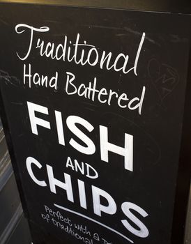LONDON, UK – APRIL 15, 2014: Sign advertising british fast food, fish and chips.