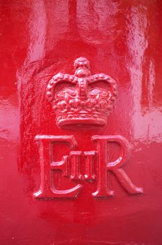 LONDON, UK – APRIL 15, 2014: Detail of an English mailbox, the monogram of Queen Elizabeth II.
