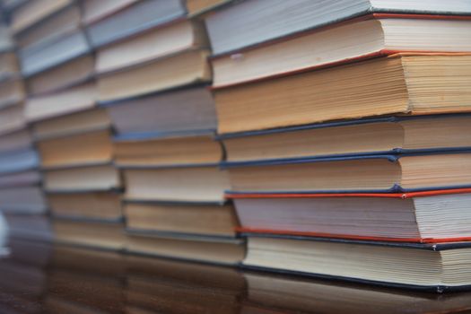 Many old books on the table. Close-up view