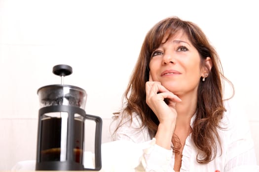 A beautiful mature woman with some Coffee.