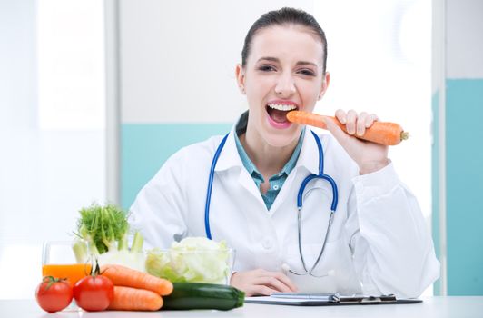 A portrait of cheerful healthcare professional promoting healthy eating