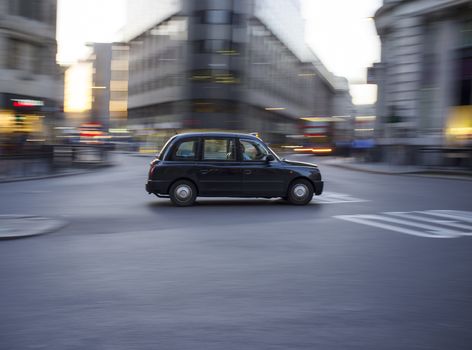 LONDON, UK – APRIL 16, 2014: Motorised hackney cabs in the UK, traditionally all black in London and most major cities, are traditionally known as black cabs