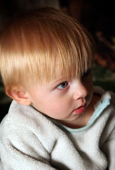 Baby Boy Portrait in the Dark Room