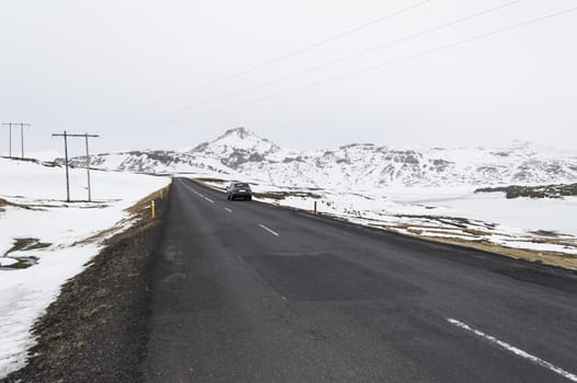 the road to  snaefellsne on the island iceland with mountains in winter