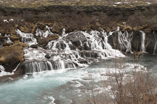 Hraunfossar waterfall with blue water on iceland