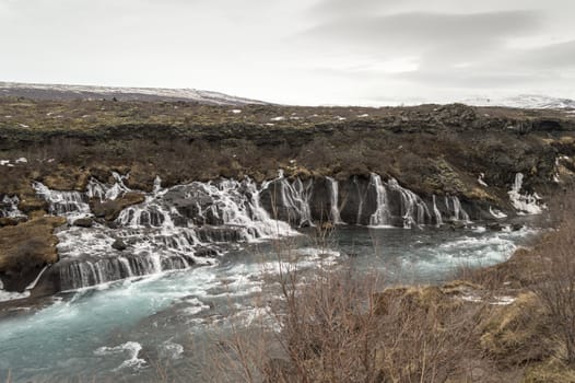 Hraunfossar waterfall with blue water on iceland