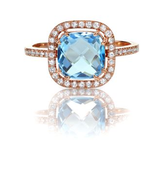 Beautiful Blue Topaz and diamond Rose Gold Halo Ring Cushion Cut with a square princess style setting