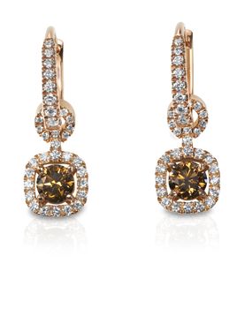 Beautiful brown diamond chocolate diamond earrings isolated on white with a reflection. 