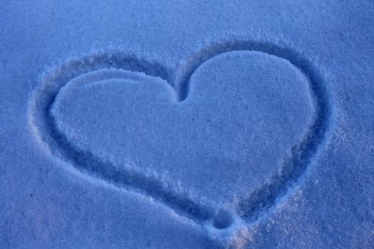 silhouette of heart on Valentine's Day snow