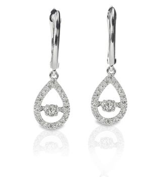 Teardrop shaped dangle drop diamond earrings are isolated on a white background with reflections
