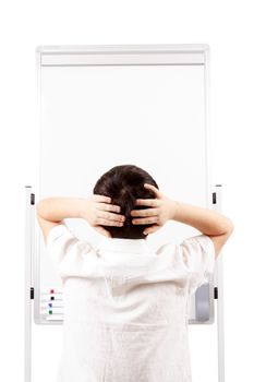 young boy student is surprised and looking on empty whiteboard