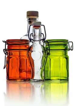 Empty glass jars and empty little glass bottles isolated on white background