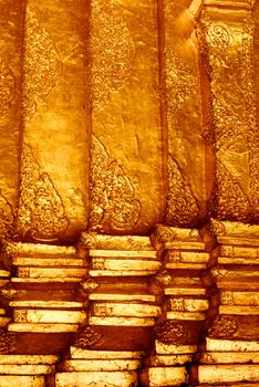 the high detail of square hall with pyramidal roof that made by real gold plate and decorated by craving thai pattern,Lampang temple,Thailand