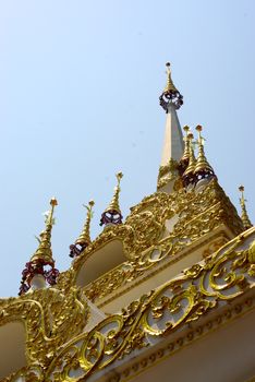  complicated stucco work showing of traditional thai pattern that decorated with mirror and precious stone at temple entrance gate ,Lampang
 temple,Thailand